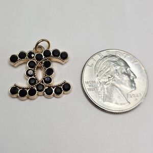 Authentic CHANEL Black and Gold Pendant